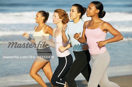 Women Jogging On The Beach