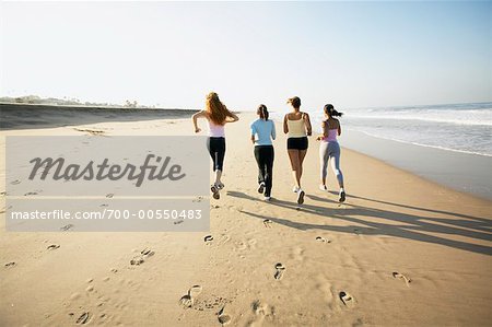 Women Jogging On The Beach