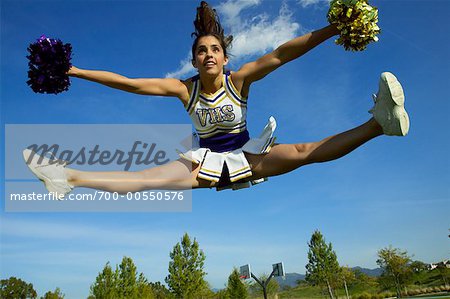 Cheerleader Jumping Up In The Air