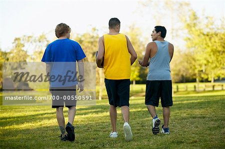 Three Male Teenagers Walking Away