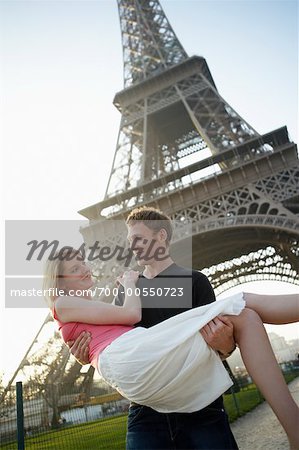 Couple by Eiffel Tower, Paris, France