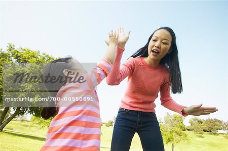 Mother Giving Daughter High-Five