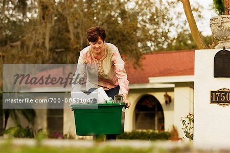 Woman Taking Out Recycling