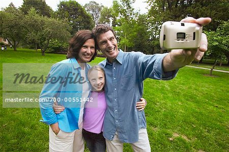 Father Taking Picture of Family