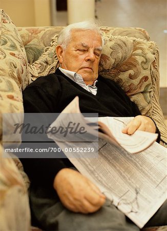 Man Sleeping in Chair