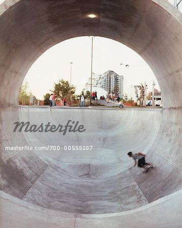 Skateboarder in Concrete Tube