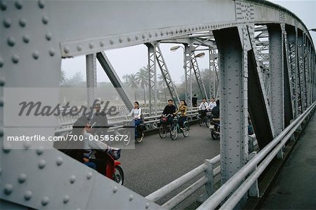 People Crossing Bridge on Bicycles, Hue, Vietnam