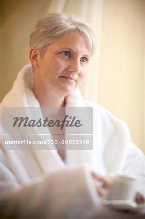 Woman in Bathrobe with Coffee Cup