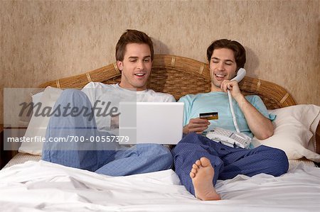 Male Couple Home Shopping