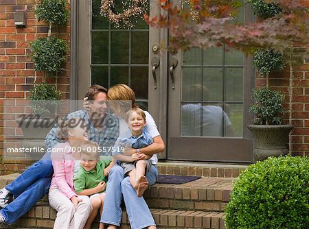 Family Sitting Outdoors