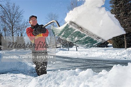 Man Shovelling Snow, Mississauga, Ontario, Canada