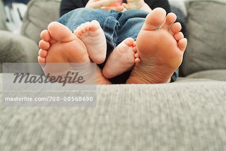 Feet of Baby and Adult