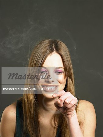 Woman Pointing at Smoke Ring