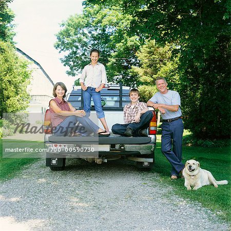 Family in Back of Pickup Truck