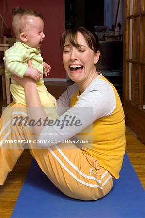 Crying Mother Holding Crying Baby