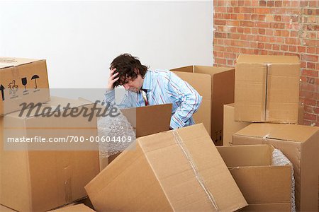 Man Surrounded by Cardboard Boxes