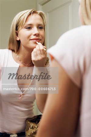 Young Woman Applying Make-Up