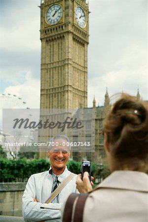 Woman Taking Picture of Man, London, England