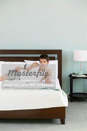 Man Lying on Bed