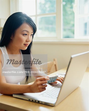 Woman Using Laptop at Home