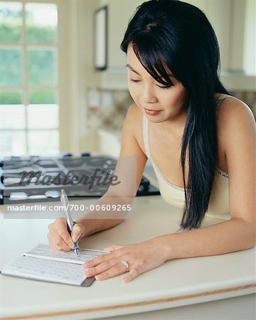 Woman Writing Cheque