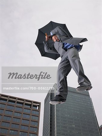 Businessman Falling, Holding Umbrella