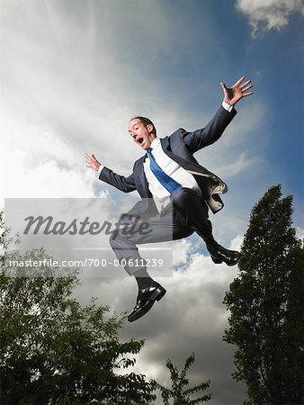 Businessman Jumping in Air
