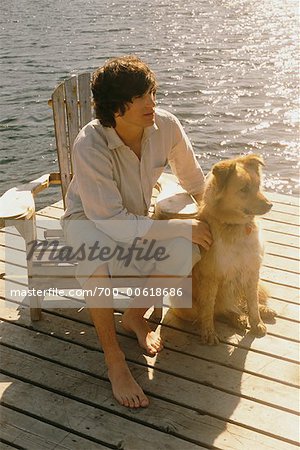 Man on Dock with Dog