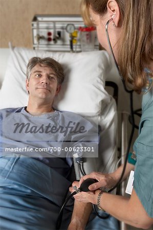 Nurse Checking Man's Blood Pressure