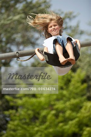 Girl Playing on Swing