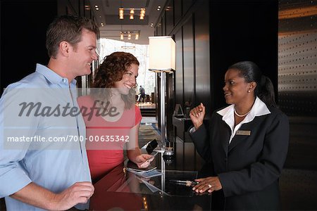 Couple Checking in at Hotel