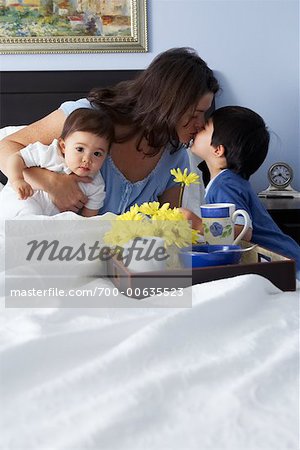 Boy Bringing Mother Breakfast in Bed
