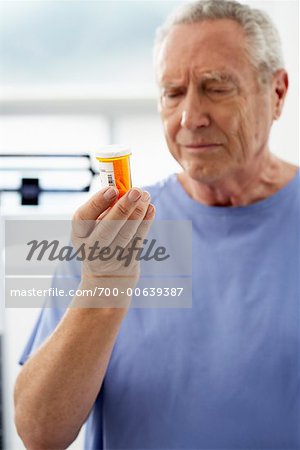 Man Holding Pill Bottle