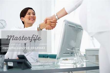 Doctor Shaking Hands with Patient