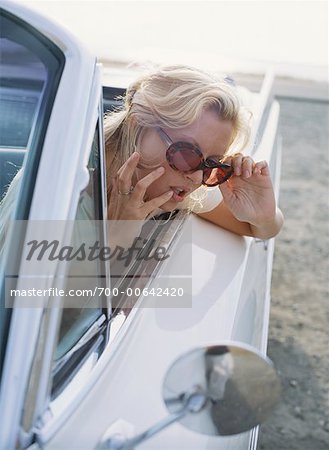 Woman Checking MAke-up in Car
