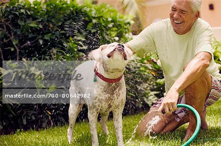 Man Bathing Dog