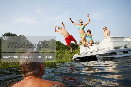 Teens Jumping off Boat