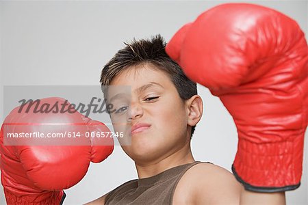 Boy wearing boxing gloves