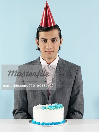 Homme D Affaires Avec Le Gateau D Anniversaire Photographie De Stock Masterfile Rights Managed Artiste Tom Feiler Code 700