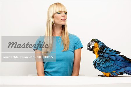 Woman Having Argument with Blue and Yellow Macaw