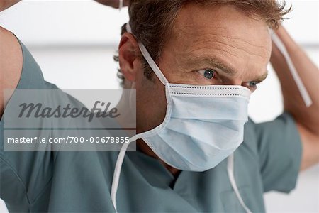 Doctor Putting on Surgical Mask