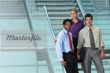 Portrait of Business People Standing on Stairs