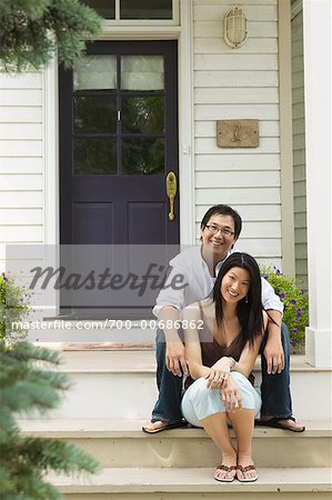 Portrait of Couple Outside of House