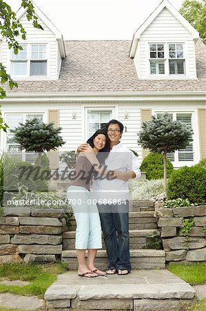 Portrait of Couple Outside of House