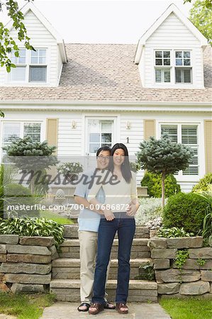 Portrait of Couple in Front of Home