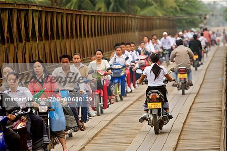 People on Scooters Crossing Bridge Over the Nam Khan River, Luang Prabang, Laos