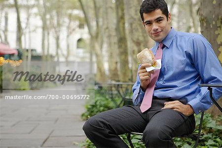 Businessman Eating, Bryant Park, New York, New York, USA