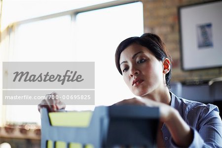 Woman Looking through Files