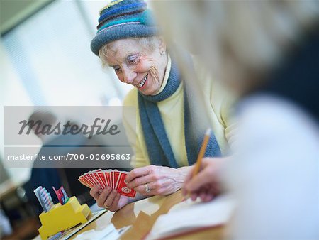 Elderly Woman Playing Cards