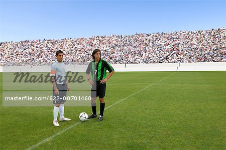 Opposing captains posing with ball